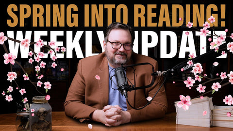 Brandon Sanderson amid blossoms, with a brown coat and a blue shirt. Spring into Reading! + Weekly UPdate